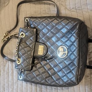 Persaman italian leather beautiful quilted backpack with gold chain trimmings.